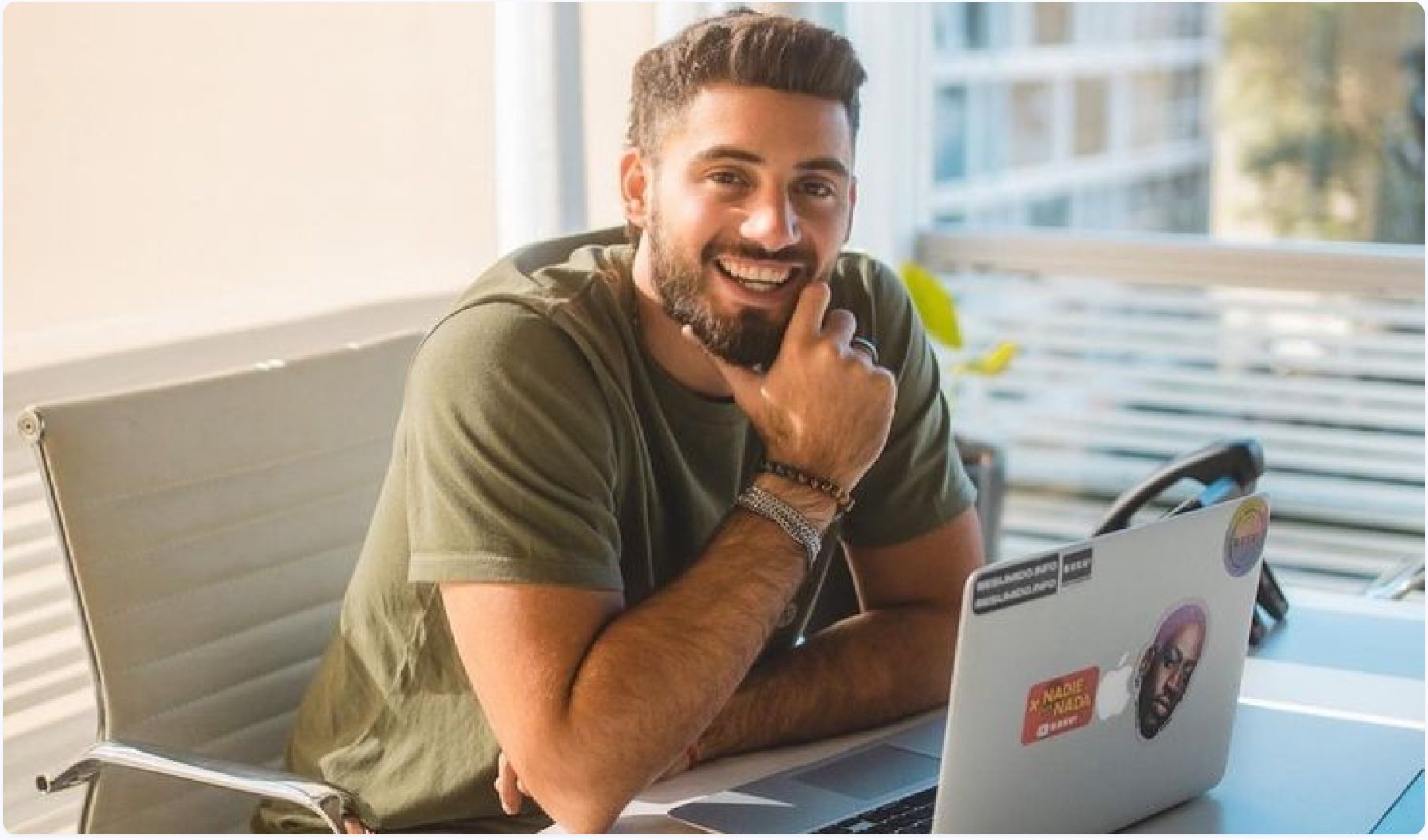 Satisfied freelancer working on a hot desk